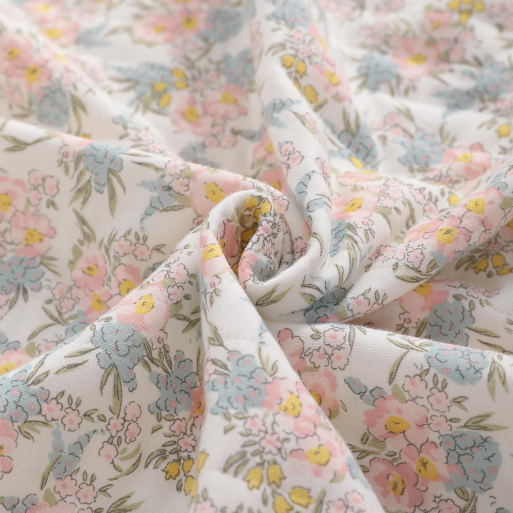 NTBAY Jersey Cotton Quilted Toddler Blanket pink floral folded to highlight size and warmth