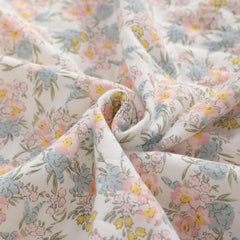NTBAY Jersey Cotton Quilted Toddler Blanket pink floral folded to highlight size and warmth