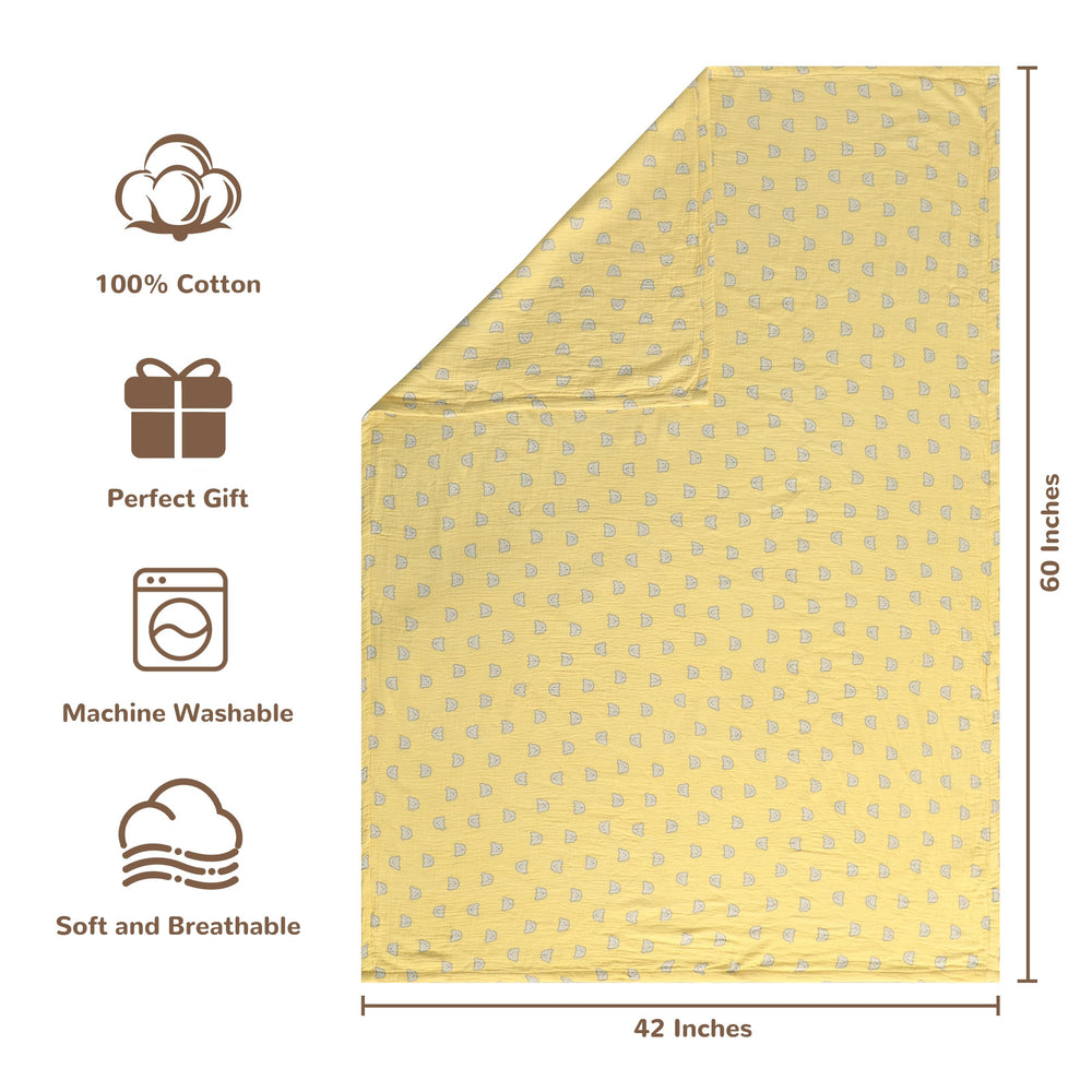 NTBAY muslin cotton blanket on crib shows reversible patterns for versatile naps.