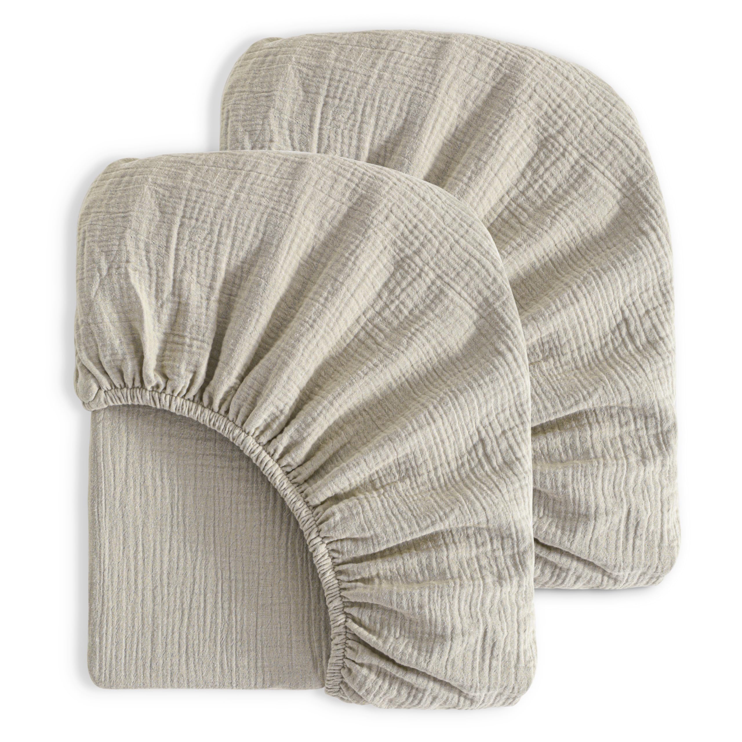 NTBAY muslin crib sheets folded view, soft breathable fabric for cozy naps