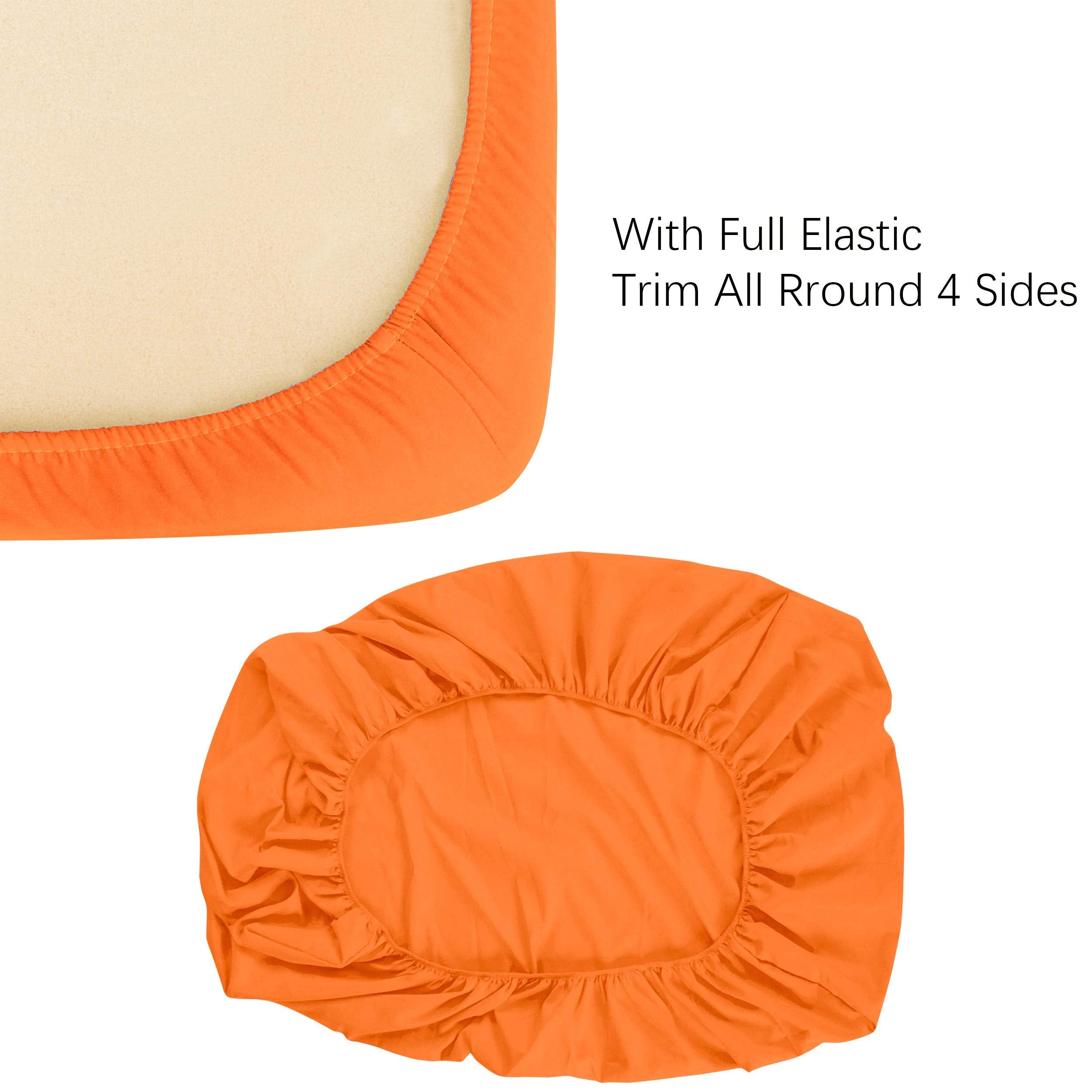 NTBAY orange crib sheet folded for storage and quick change.
