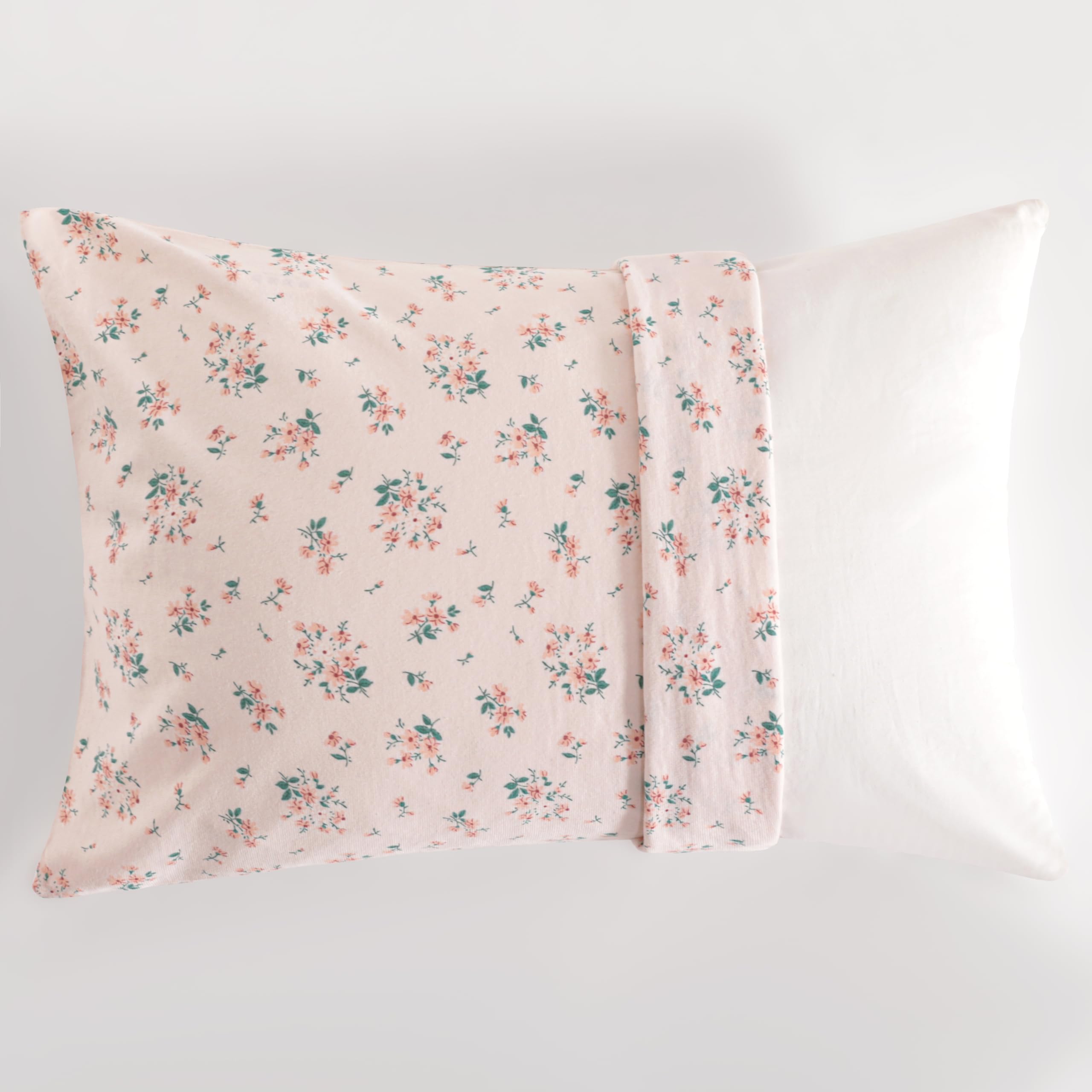 NTBAY pink floral pattern adds cute nursery decor to a crib or bed.