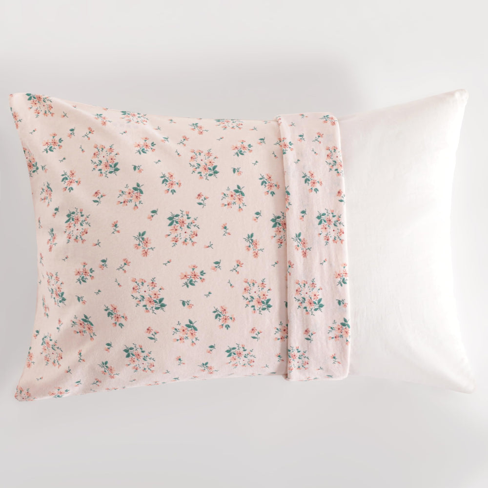 NTBAY pink floral pattern adds cute nursery decor to a crib or bed.