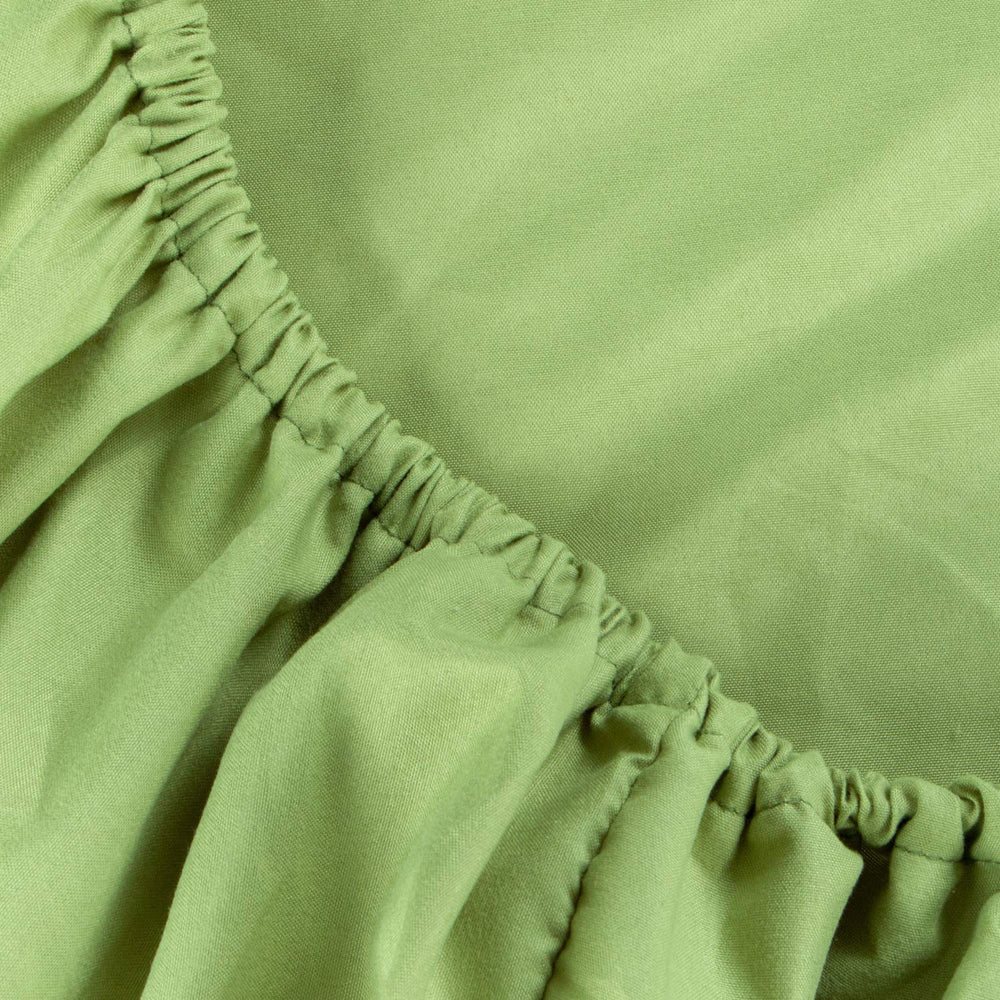 NTBAY toddler bed setup shown with green sheet for cozy naps