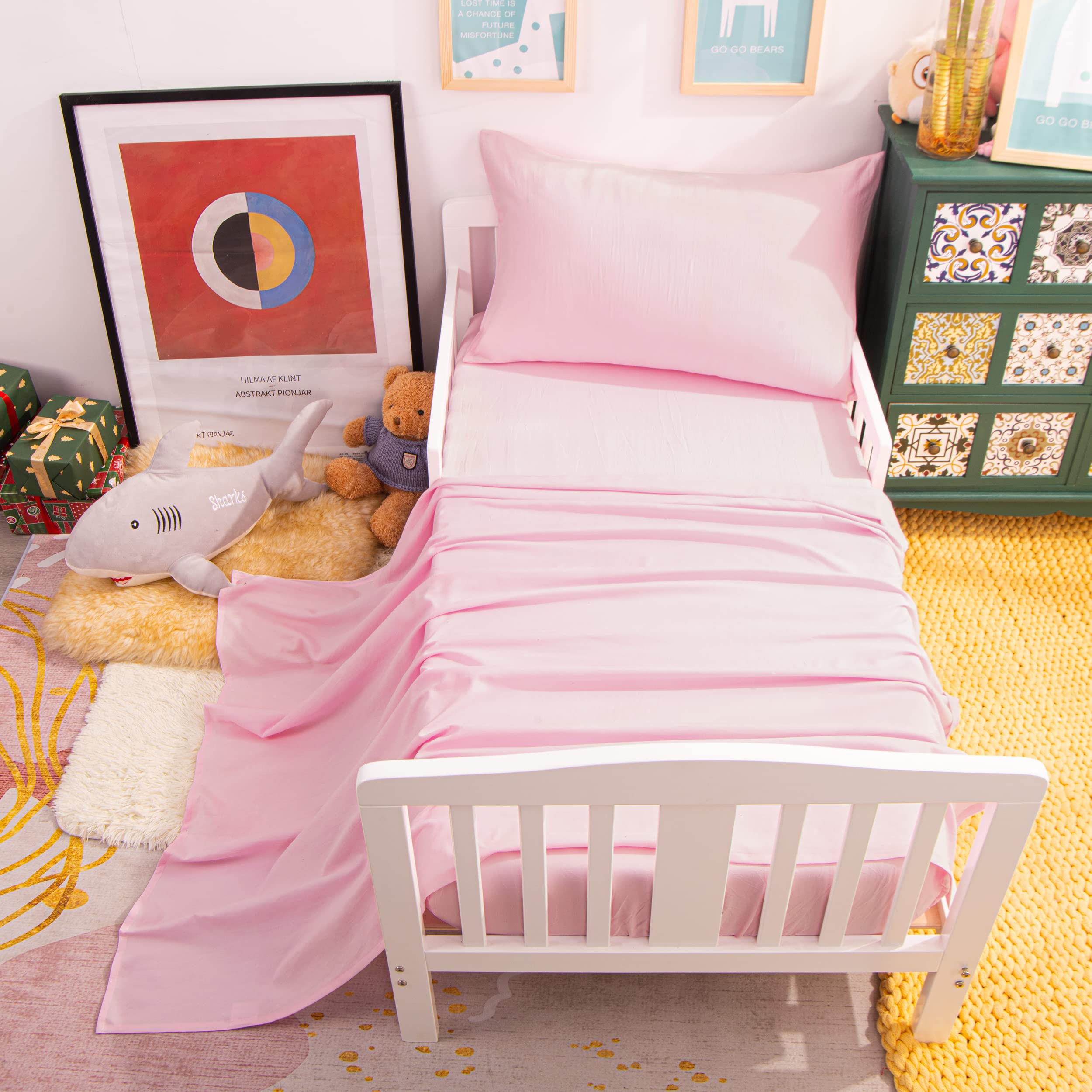 NTBAY nursery setup with pink bedding promotes a calm sleeping space.