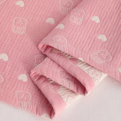 NTBAY toddler blanket 45x60 laid out on a baby bed