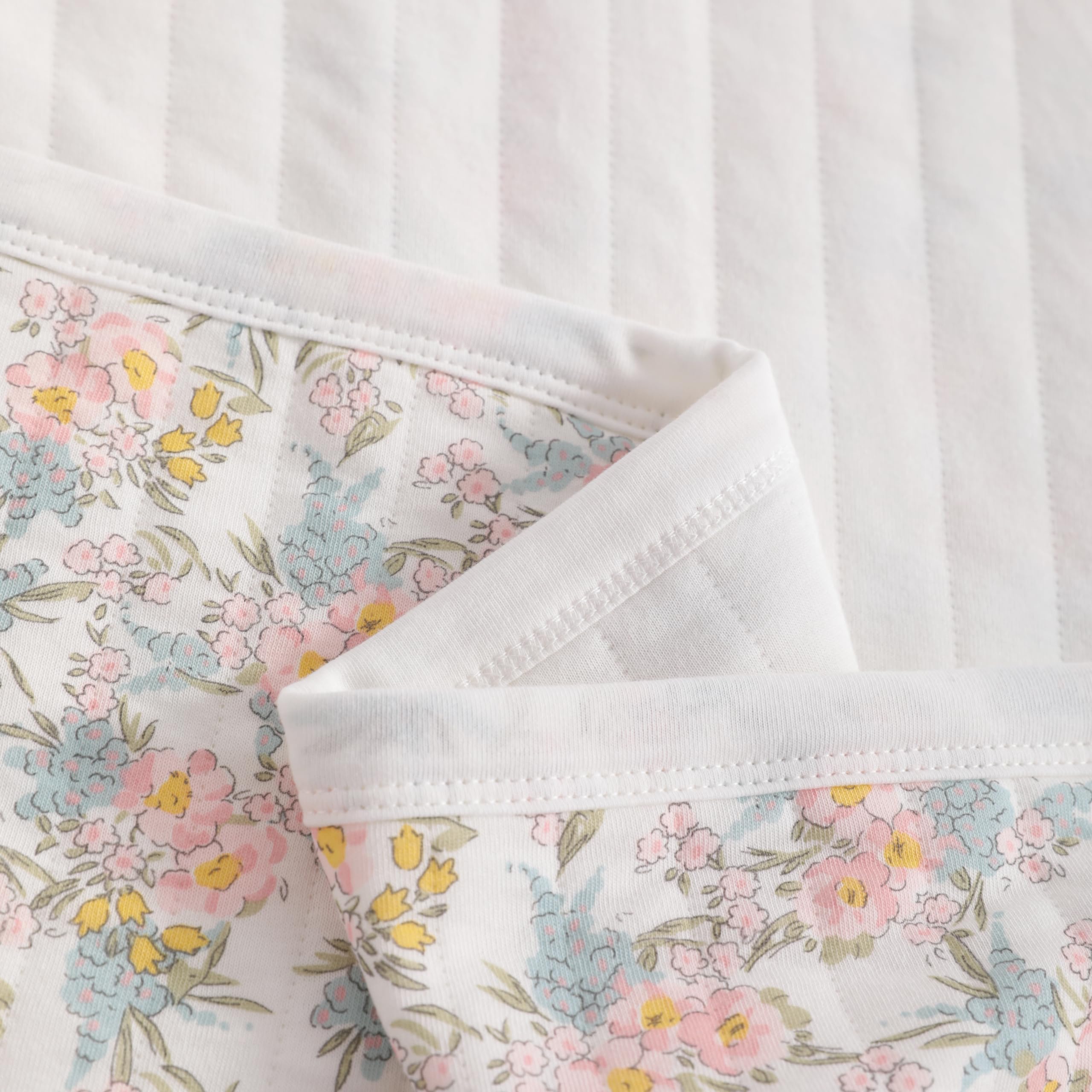 NTBAY Toddler blanket used as stroller cover in pink floral design