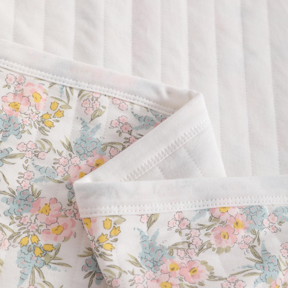 NTBAY Toddler blanket used as stroller cover in pink floral design