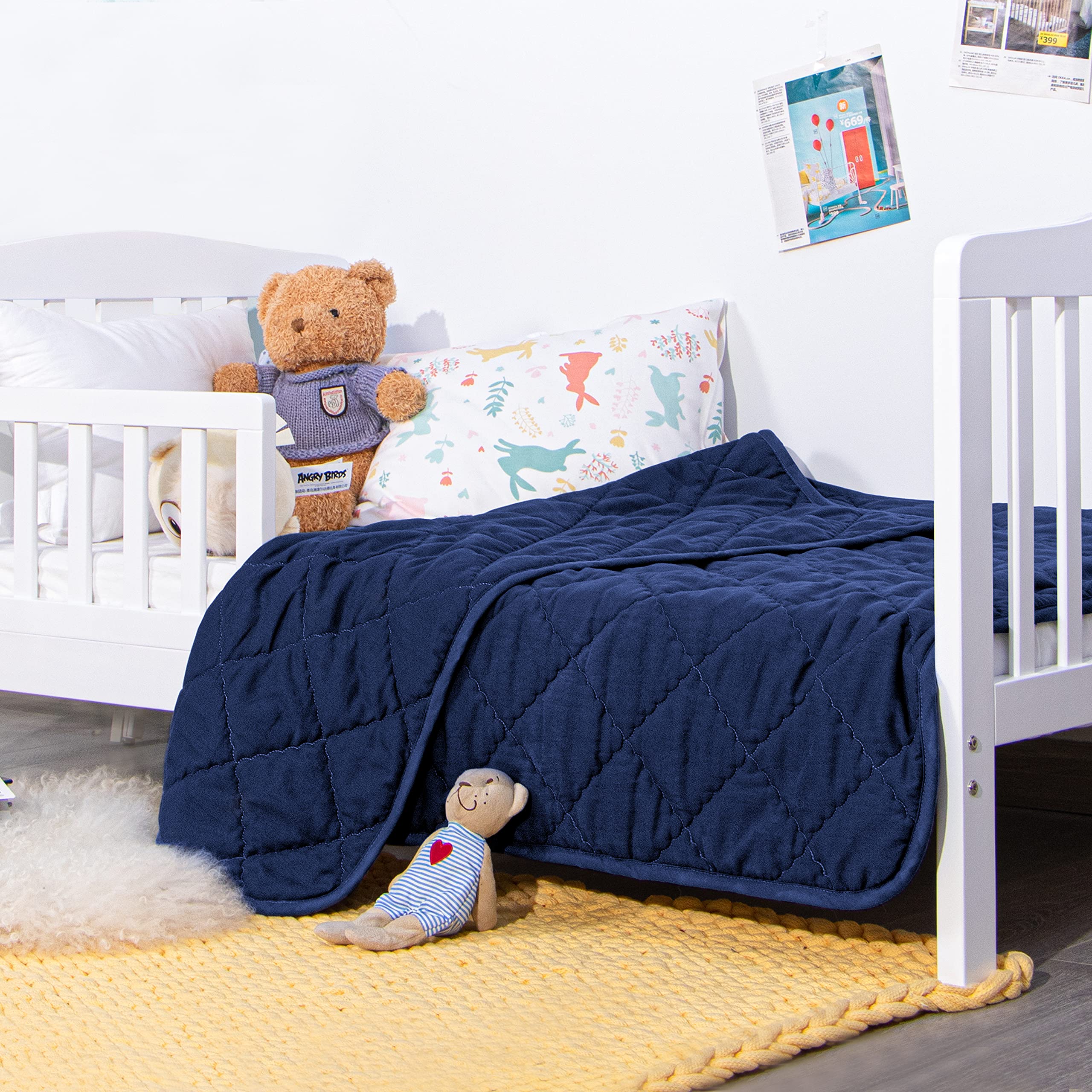 NTBAY toddler quilt navy draped for bedtime setup and easy care.