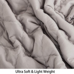 NTBAY down alternative comforter on crib scene for neutral nursery aesthetics.