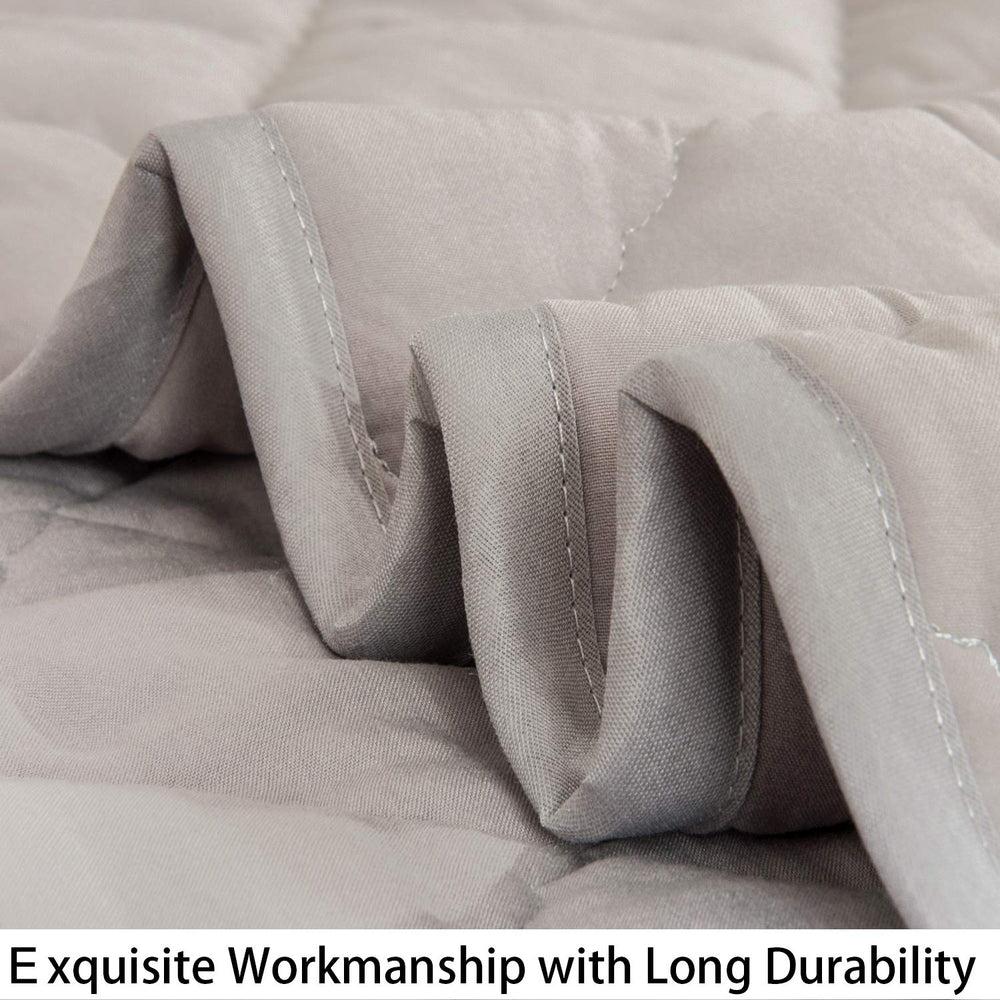 NTBAY smoke grey comforter in a nursery demonstrates versatile crib and travel use.