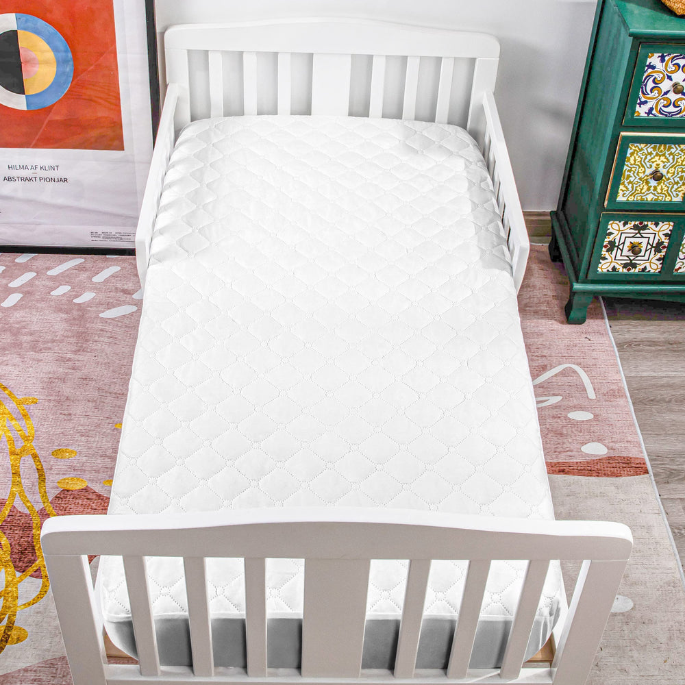 NTBAY white mini crib mattress pad offers soft and quiet protection.