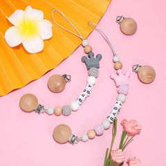 Nuanchu pacifier clips attached to a stroller for on-the-go convenience