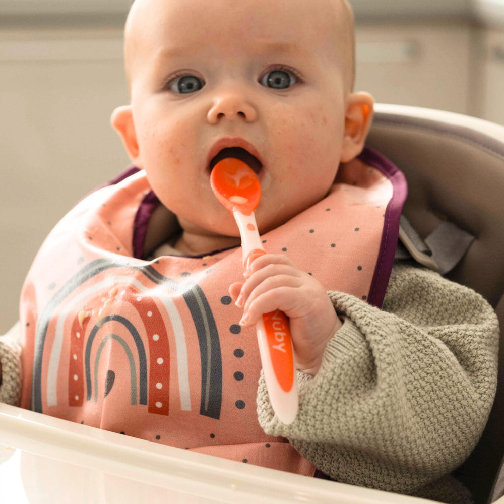 Nuby easy-grip long-handle spoon in color assortment supports comfortable feeding.