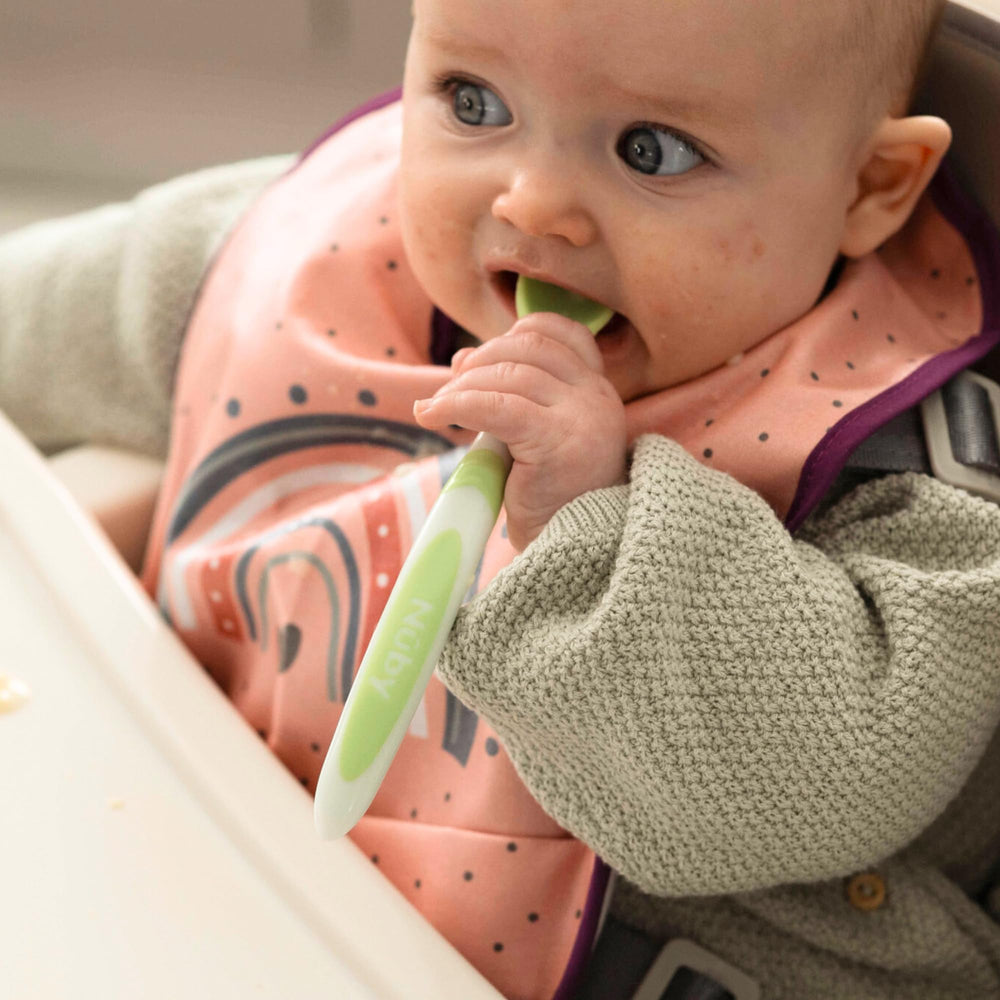 Nuby spoons promote curiosity with bright colors during meals.