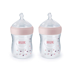 NUK Simply Natural 5 oz bottle with pink hearts offers comfortable grip.
