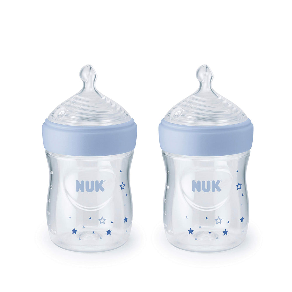 NUK Simply Natural bottle with blue stars pack, ready for convenient feeding at home.