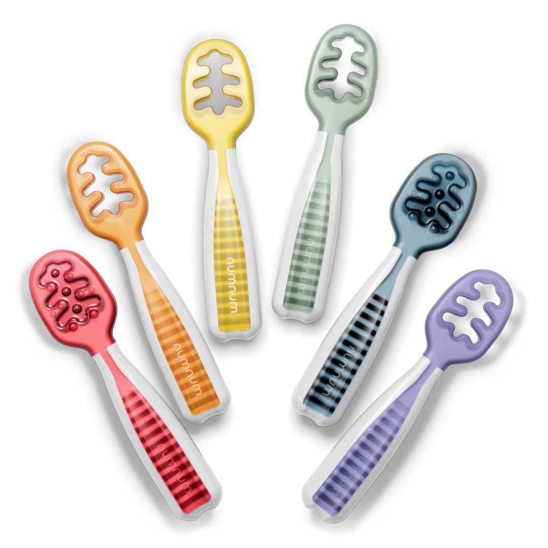 NumNum Pre-Spoon close-up shows secure grip for tiny hands during self-feeding.