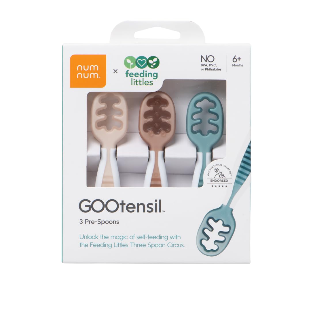 NumNum GOOtensils stage-one teether spoon easing gums and starting self-feeding.