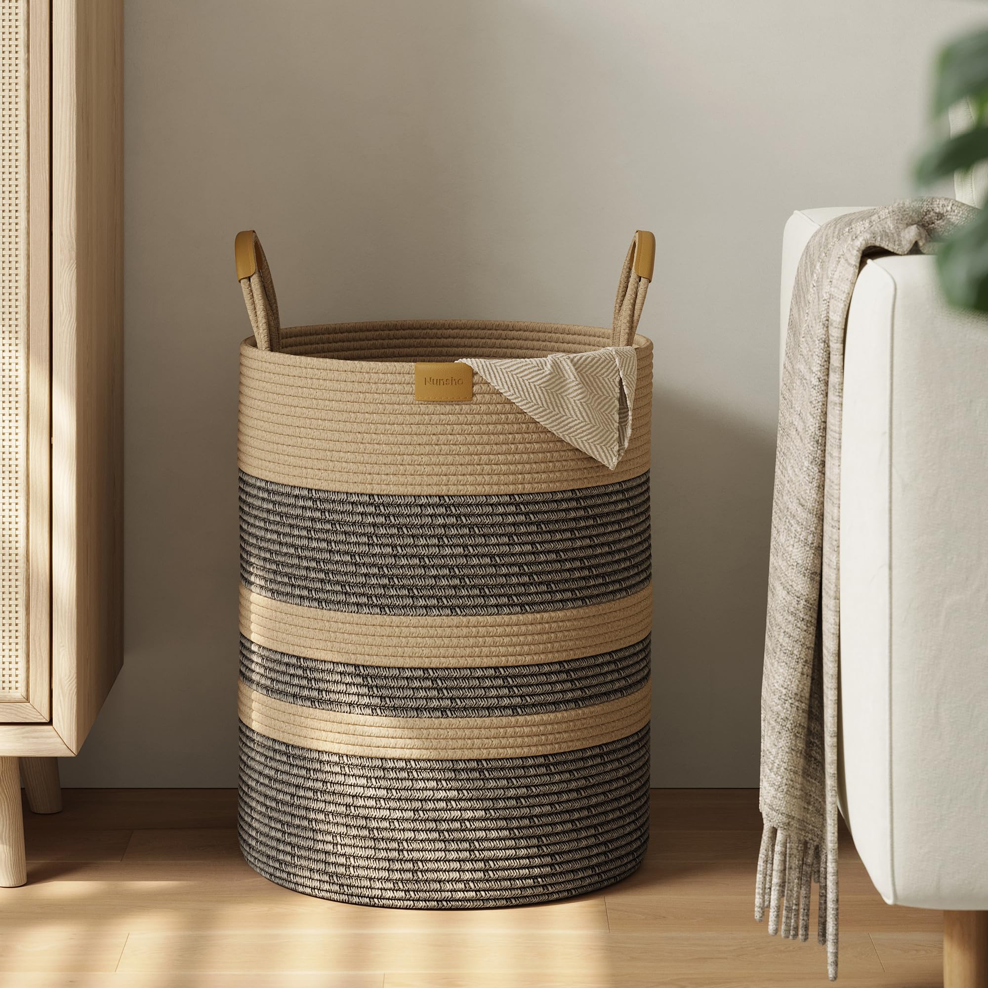 Nunsino 62L striped laundry hamper with leather handles for easy room-to-room transport.