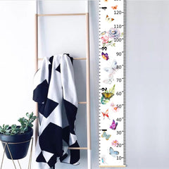 Nustila butterfly height ruler offers dual scales for feet and centimeters.