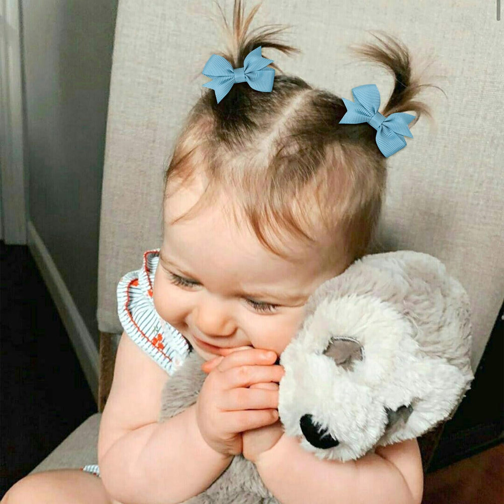 OAOLEER baby bow clip in 24 color pairs for versatile daily outfits.