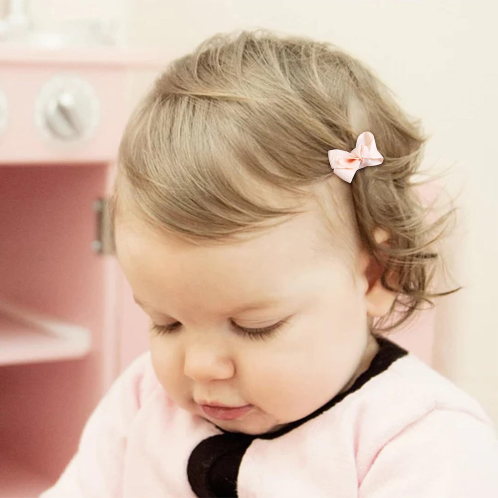 Close-up of fully lined hair clip protecting delicate baby hair.