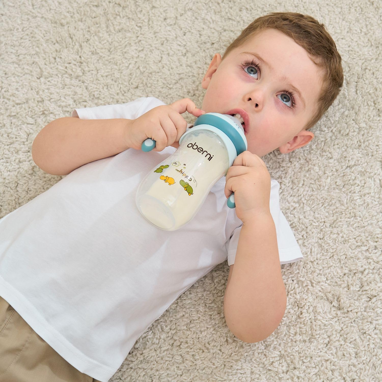 Oberni 11-ounce pink bottle shown in-use during a calm feeding.