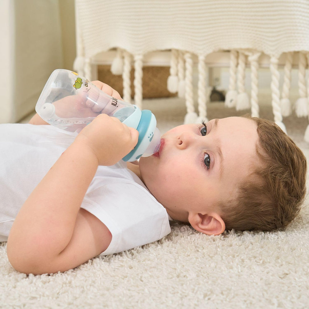 Oberni pink bottle with handle, easy grip for independent feeding.