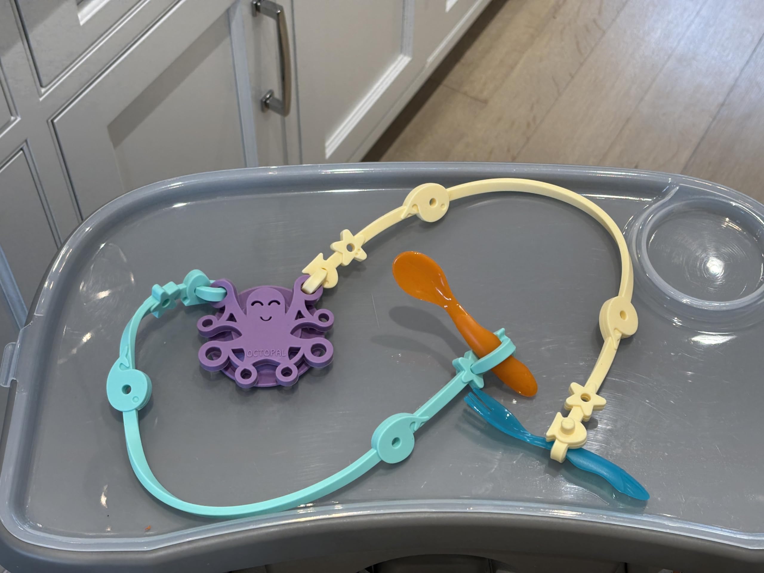 Octopal suction cup base grips smooth surfaces for stable mealtimes.
