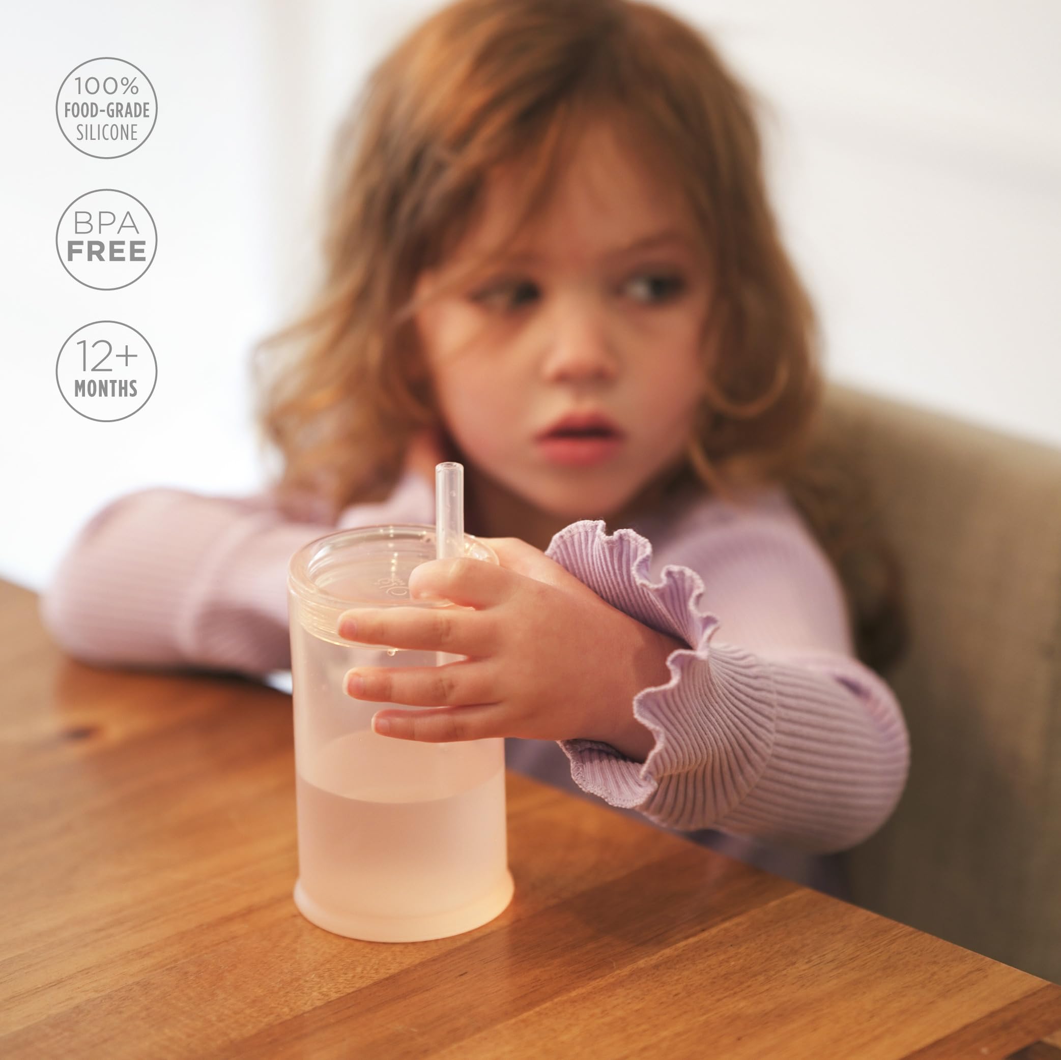 Olababy Clear View straw valve close-up demonstrating controlled flow for steady sipping