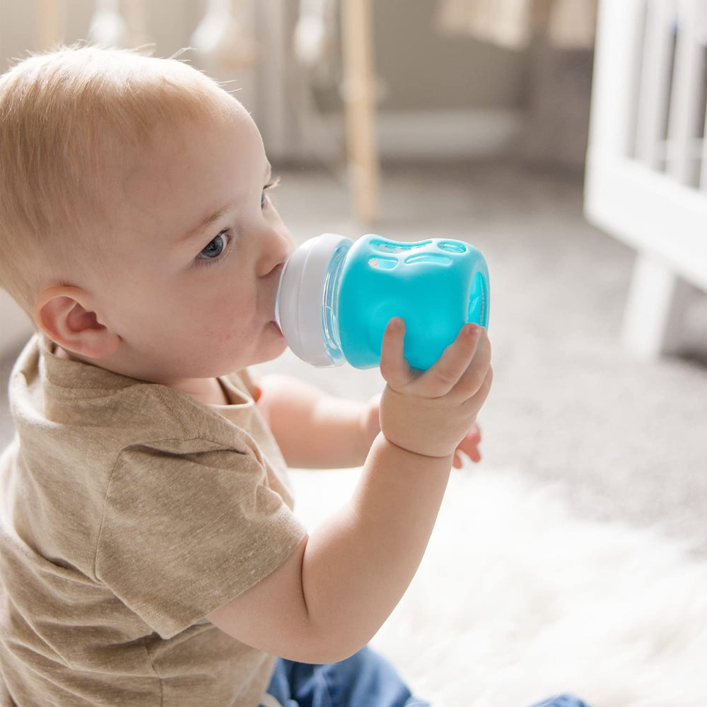 Olababy sleeve on bottle in dishwasher-safe setup.
