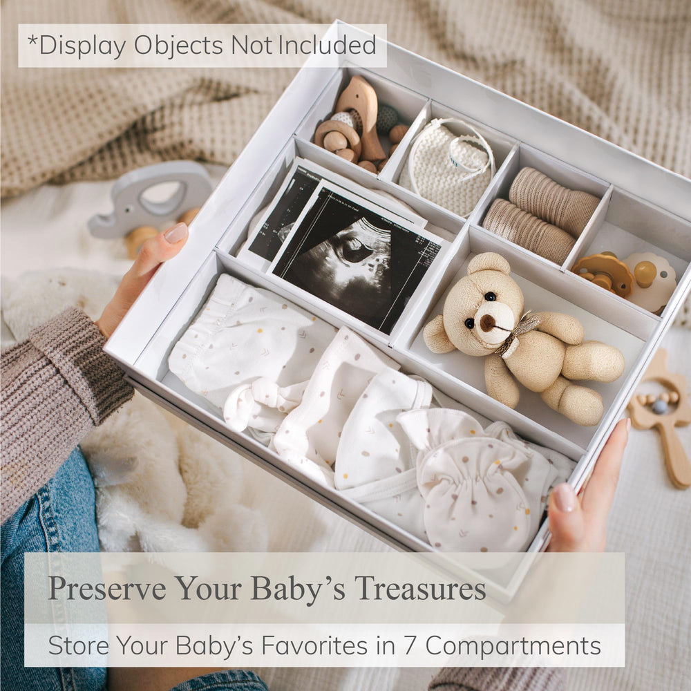 Olive & Lark keepsake box drawers for organizing first-year mementos.
