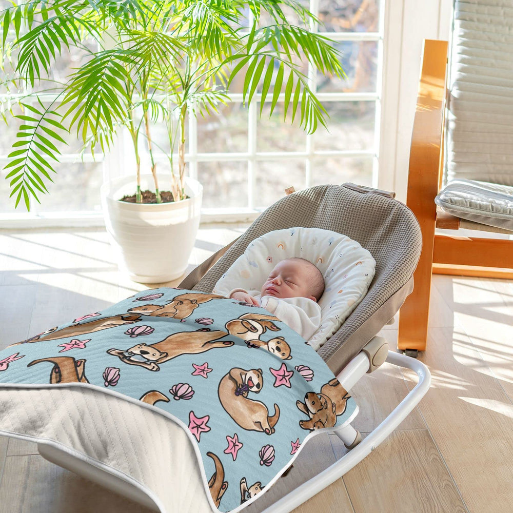 Ollabaky Otters blanket presented as a gift for new parents.