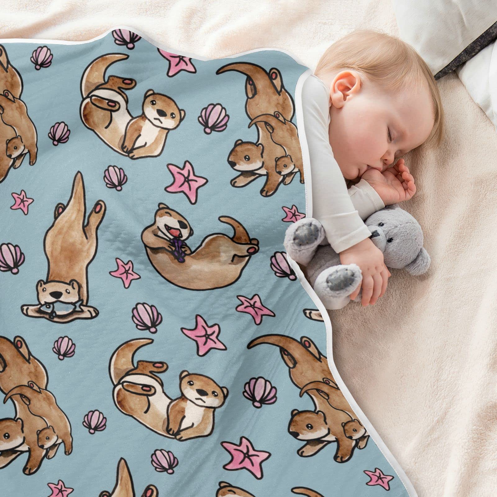 Ollabaky Otters blanket used as a stroller cover for on the go.