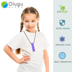 Olugu chew necklaces worn by a child for sensory support and calm focus.