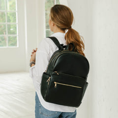 Omanmoli diaper bag backpack back view showing stroller straps and luggage sleeve.