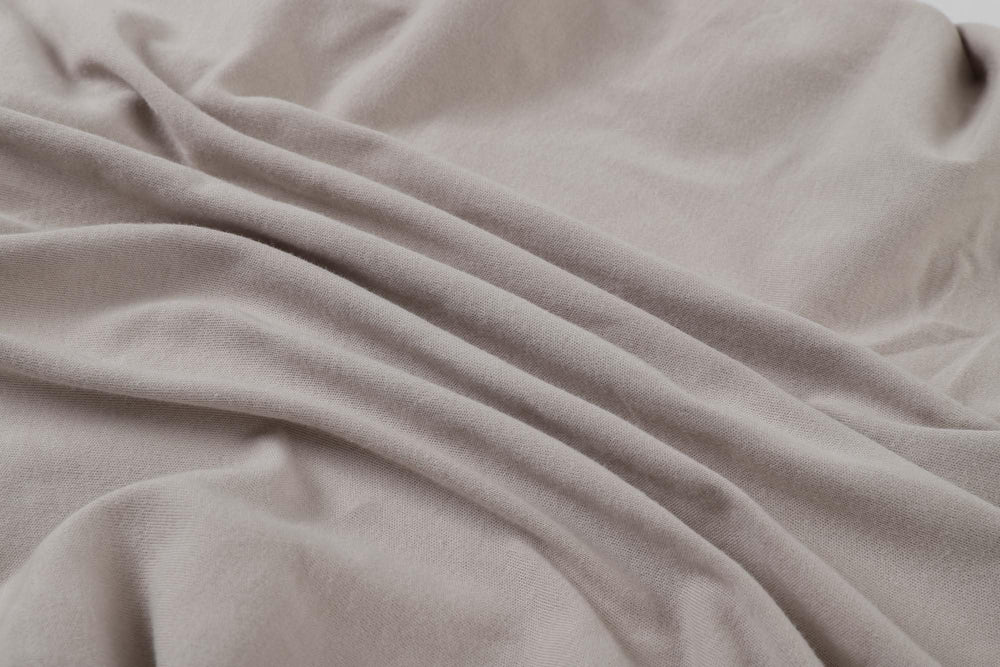 Onacosht bassinet sheets showing 360° elastic band for secure fit.