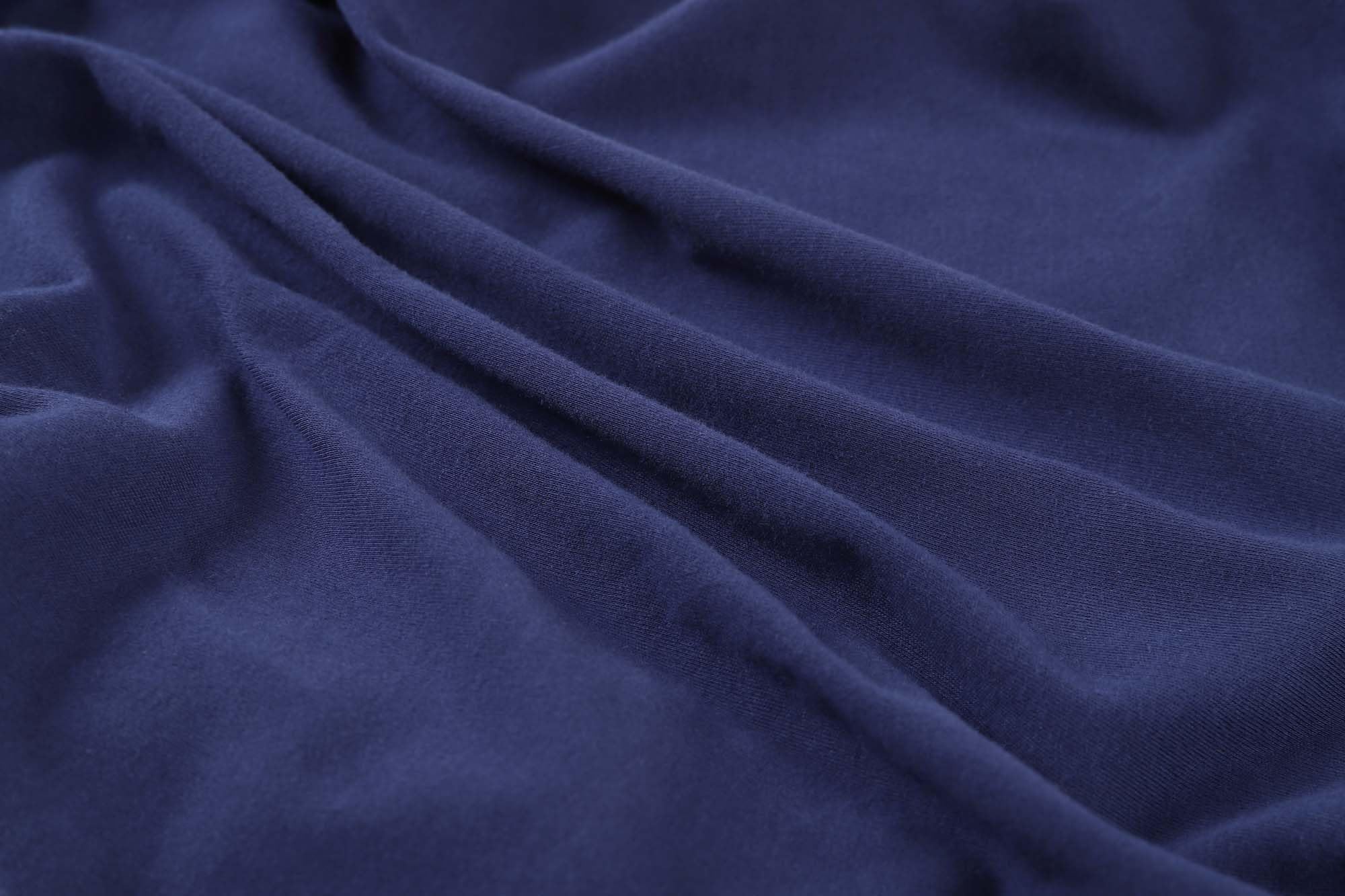 Onacosht organic cotton jersey-knit sheets feel soft against baby's skin.