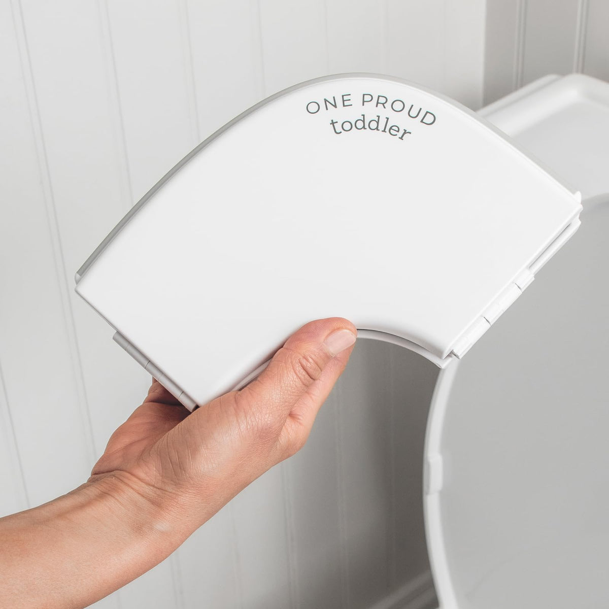 One Proud Toddler travel potty seat folded compact for easy bag storage during travel