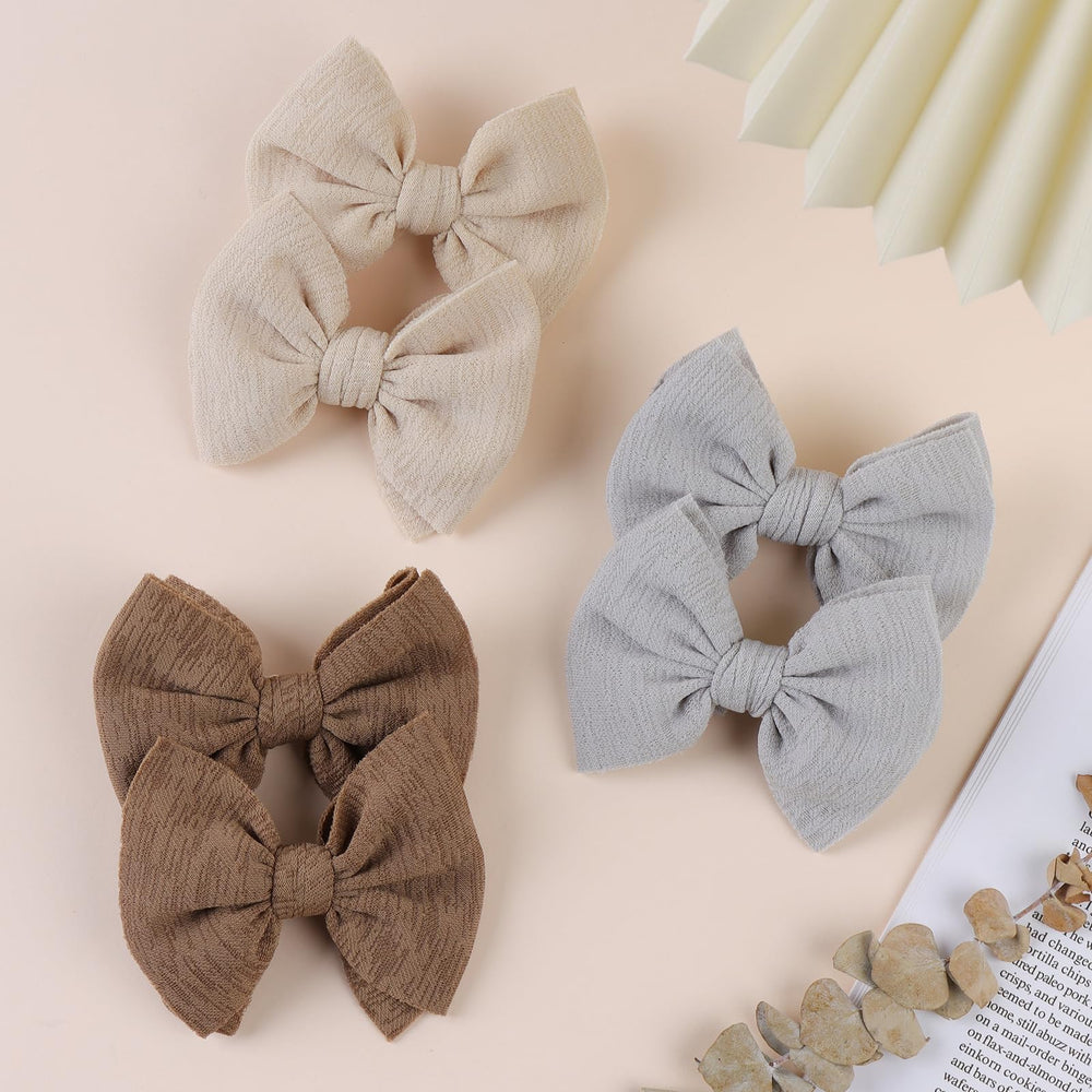 ONENINEDREAM bows worn on a toddler head demonstrating secure hold