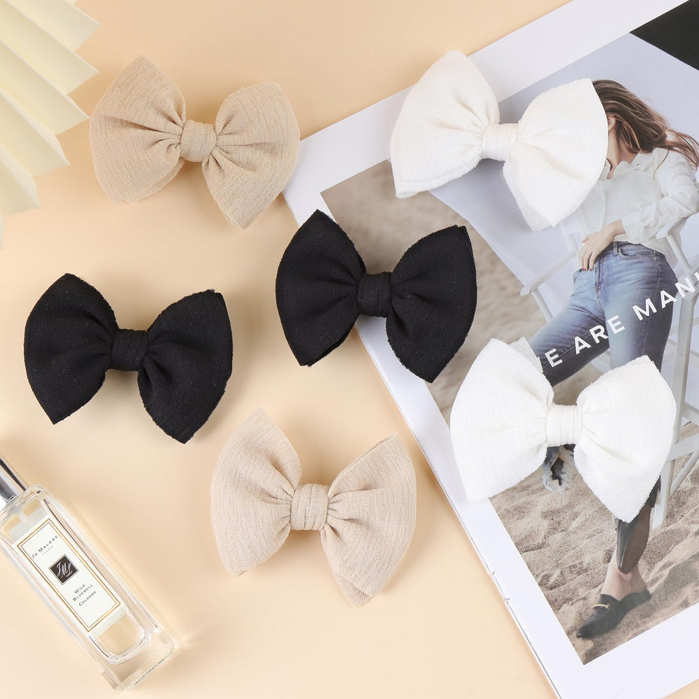 ONENINEDREAM baby bows clip close-up in beige highlights subtle sheen and comfortable fit.