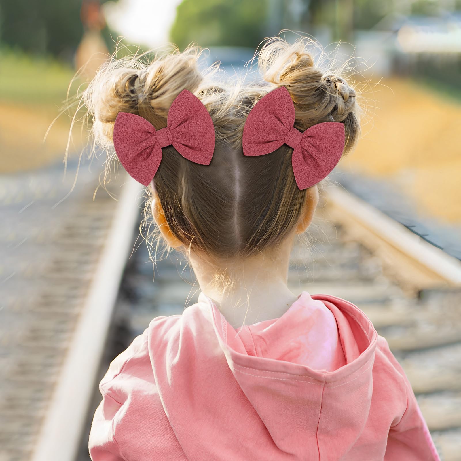 Handmade ONENINEDREAM bows in pink-wine provide soft comfort for delicate hair.
