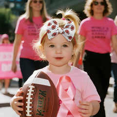 ONENINEDREAM pink ribbon accent bow, breast cancer awareness-inspired accessory for babies.