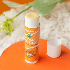 Oogiebear balm packaging highlights USA-made, clean formula.