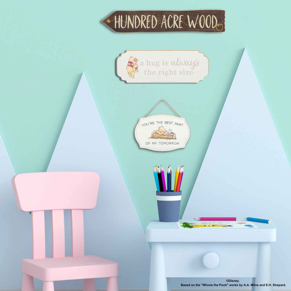 Open Road Brands Hundred Acre Wood arrow decor adds warm storytelling vibe.