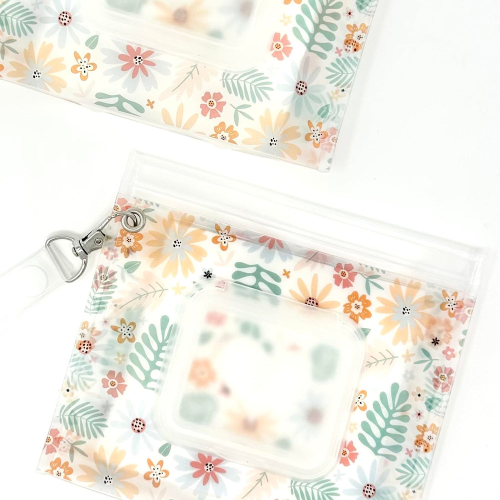 Orchid Hearts wipes dispenser with secure zipper closure keeps wipes moist.
