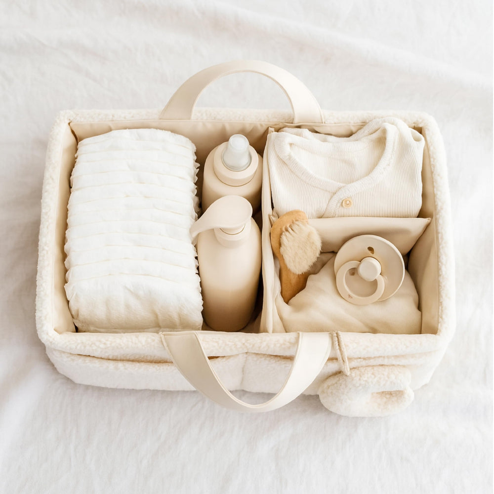 Orelle Bouclé Diaper Caddy Gold Zipper Pouch adds luxe storage on the go.
