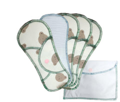 Organic cotton pads laid out to show multi-layer absorbency for daytime protection.
