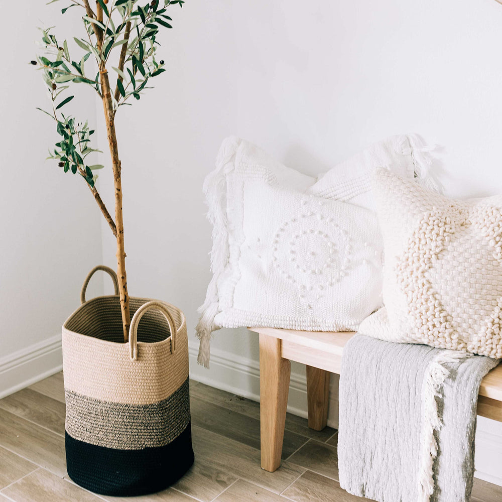 OrganiHaus blanket storage basket filled with throws for living room